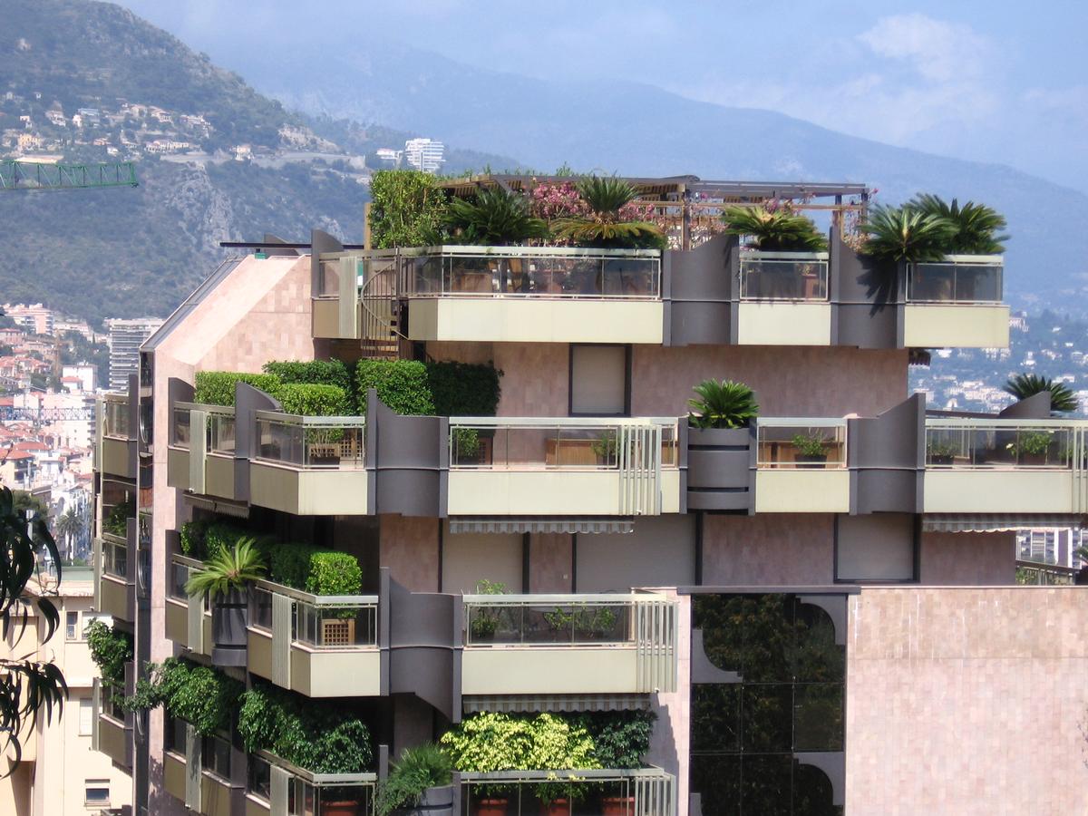 View from the Garden House Monaco showing panoramic Mediterranean coastline.
