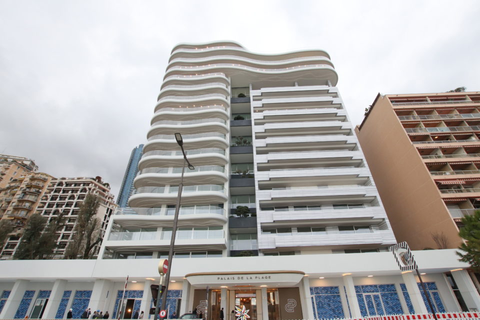 Luxury apartment exterior of Palais de la Plage Monaco, showcasing modern architecture and stunning sea views.