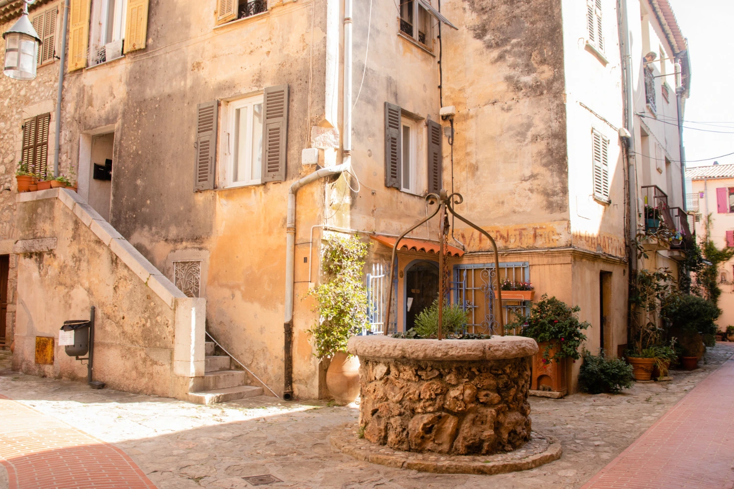 A square with a fountain in La Turbie